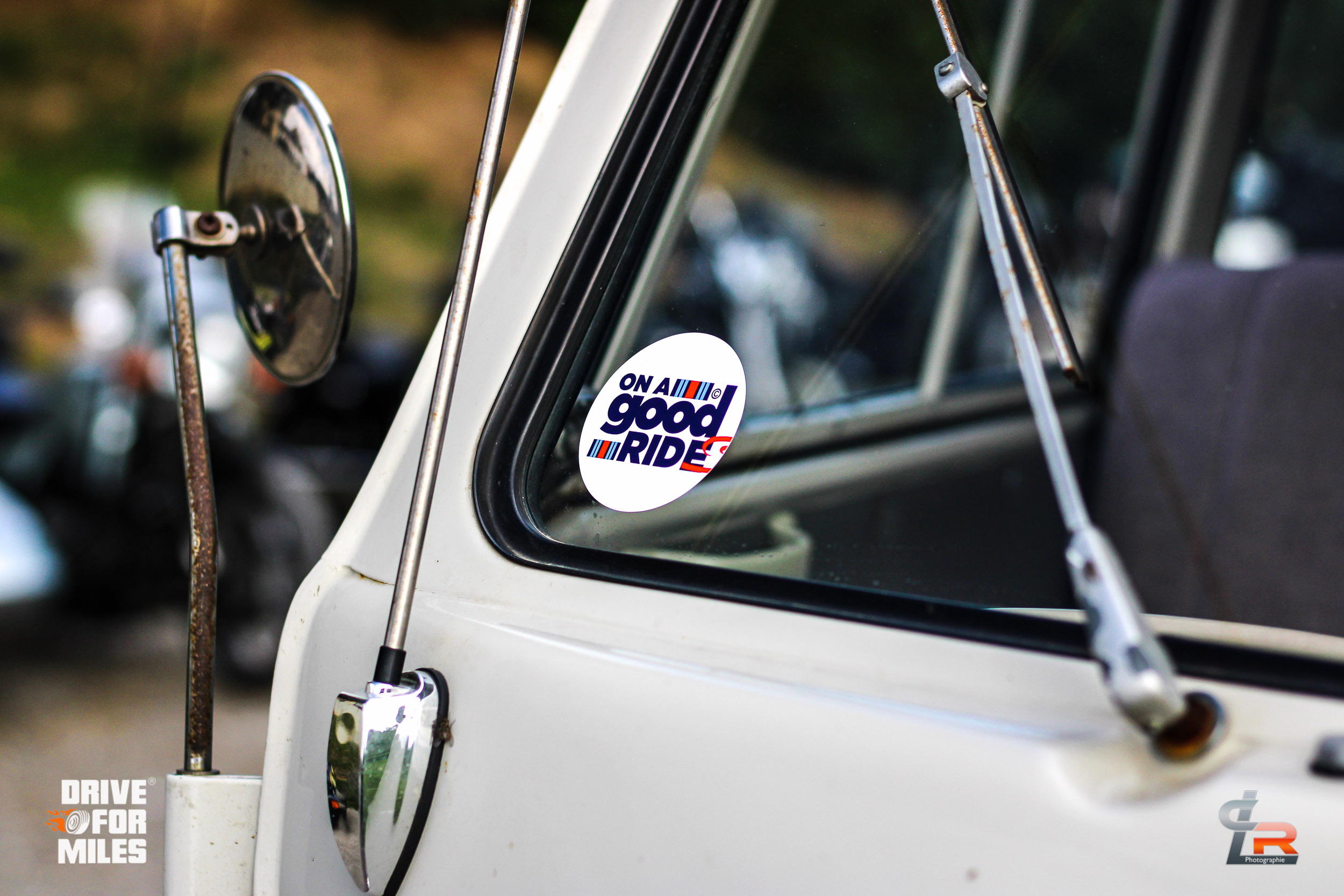 "I am a Good Ride" sticker on the window of a classic car